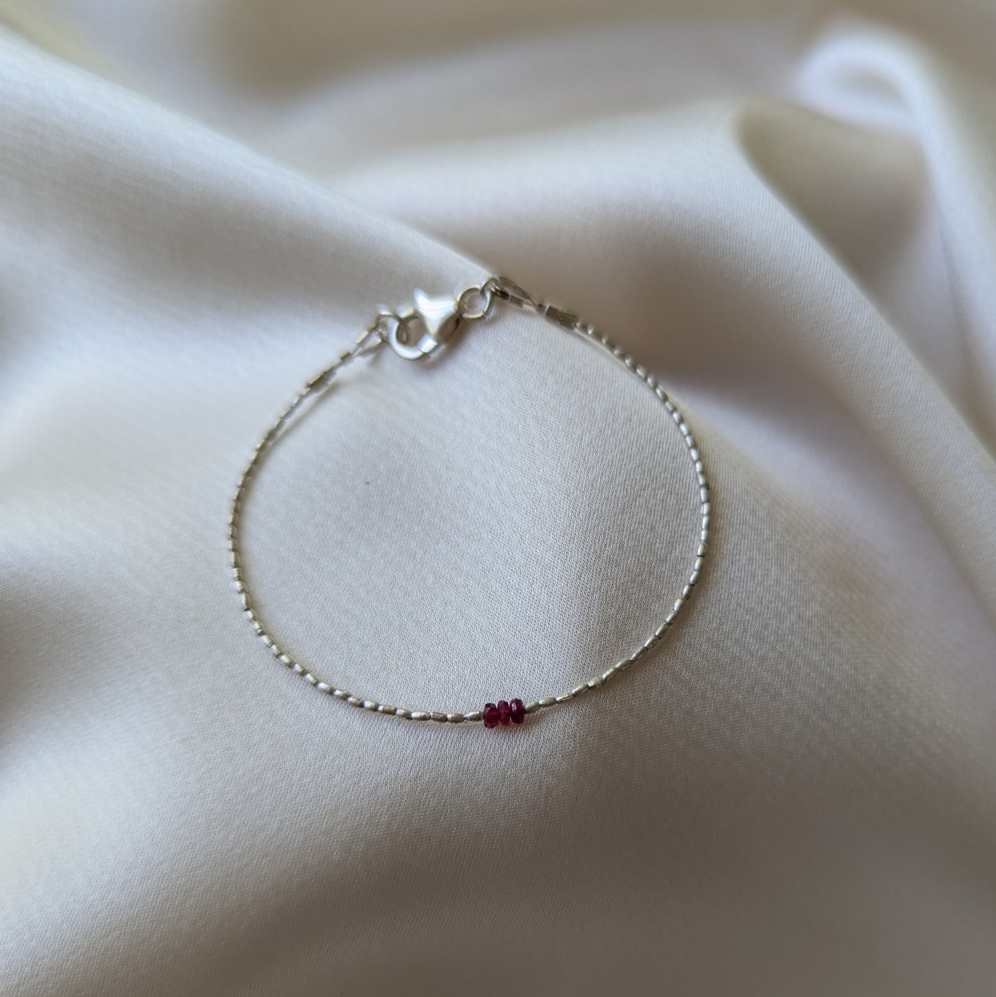 Sidhe silver and ruby bracelet